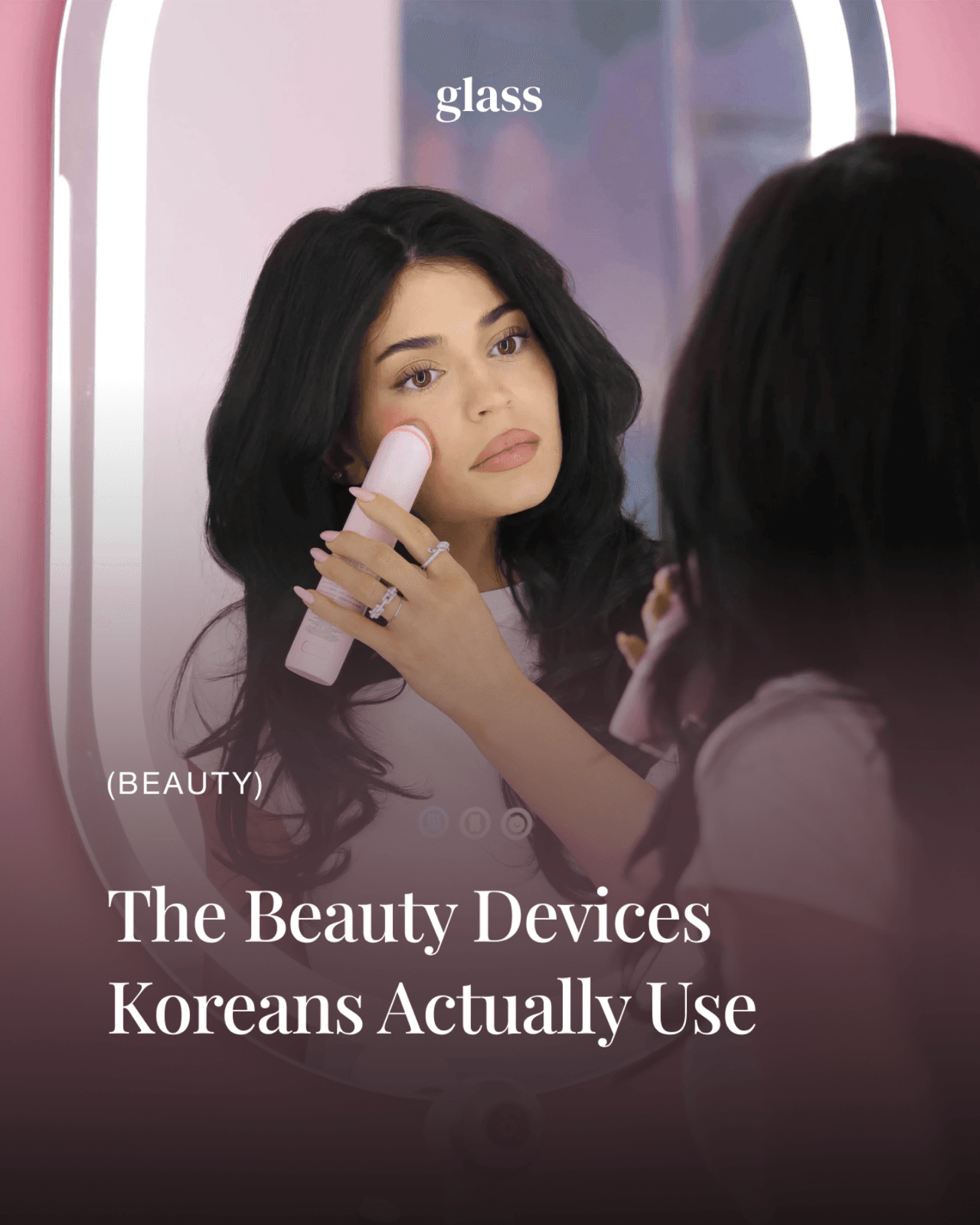 Korean beauty devices Koreans actually use — a woman using a handheld EMS device in a mirror