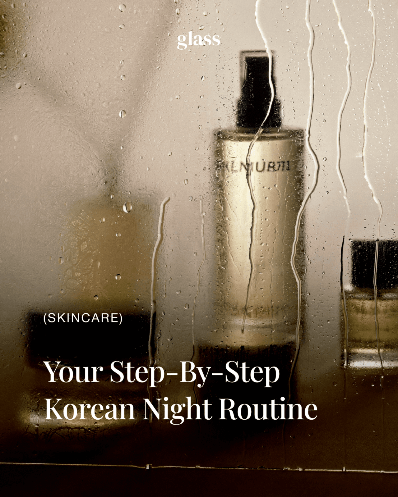 Skincare bottles behind steamed bathroom glass — the Korean night skincare routine, step by step