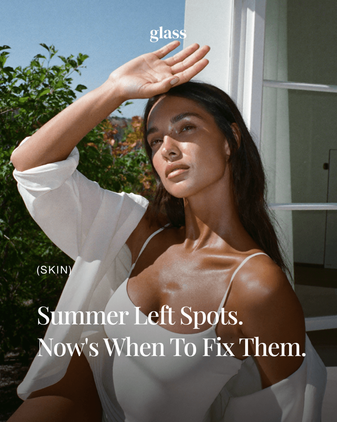 Sun spot removal in Korea: a woman shading her face from the sun, with the headline Summer Left Spots, Now's When to Fix Them